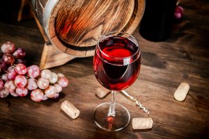 Red wine in a glass and barrel.