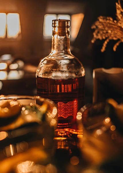 bottle of rum, photography by adison clark